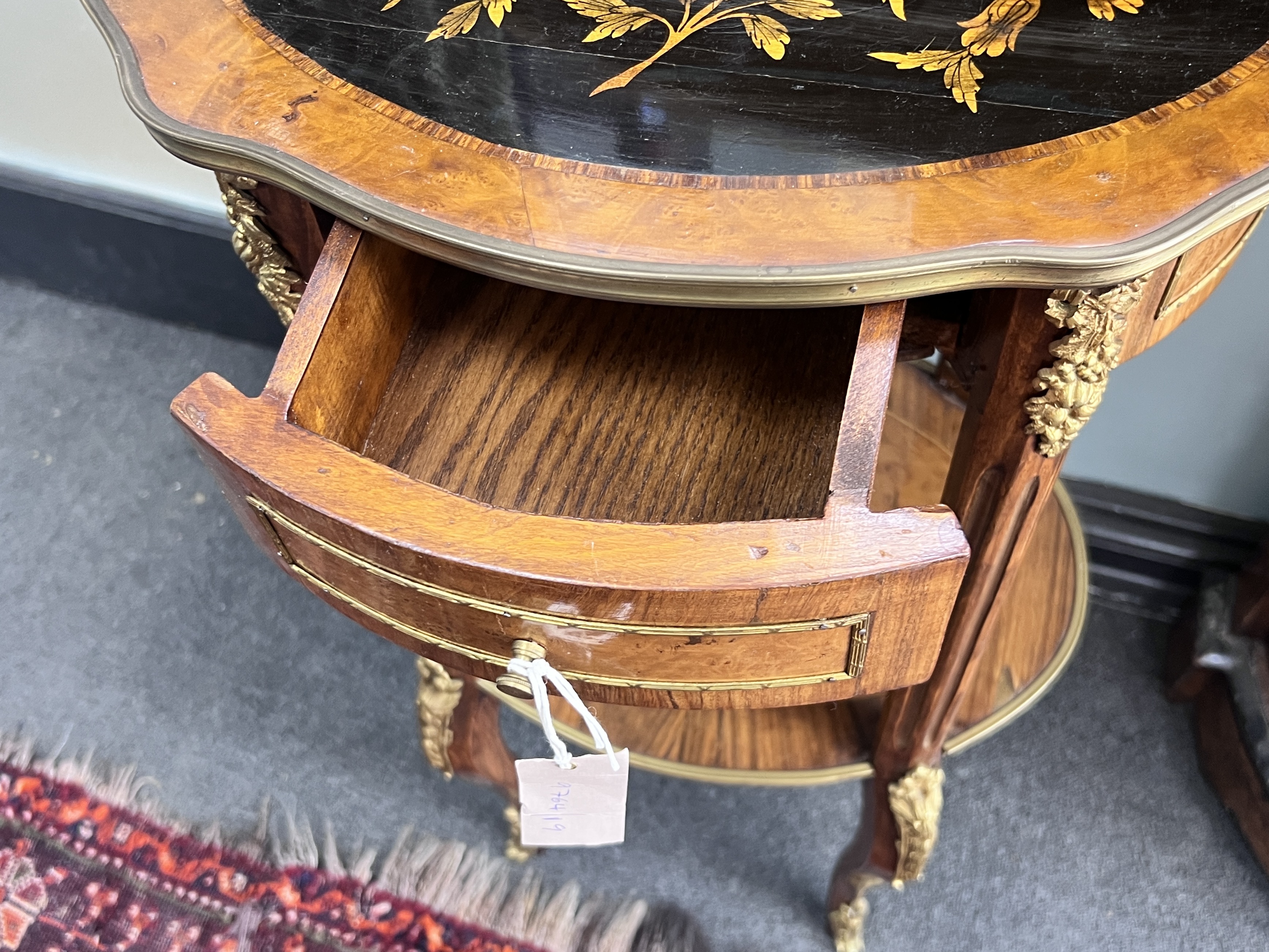 A Louis XVI style inlaid gilt metal mounted two tier table, width 47cm, depth 37cm, height 83cm